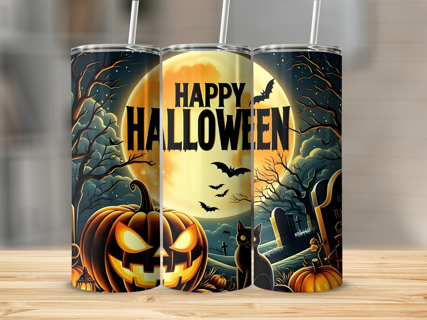 Three tumblers with Halloween designs featuring pumpkins, bats, black cats, and tombstones.