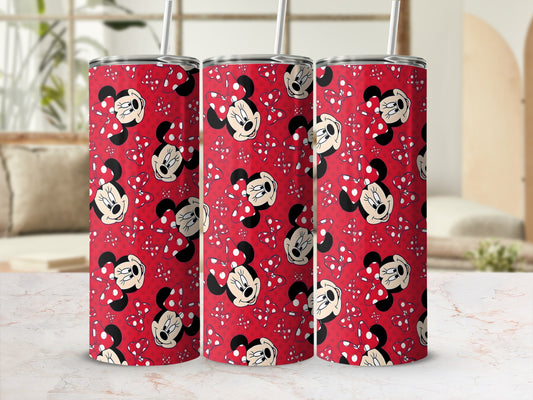 Red tumbler with repeating pattern of Minnie Mouse and white polka dots.