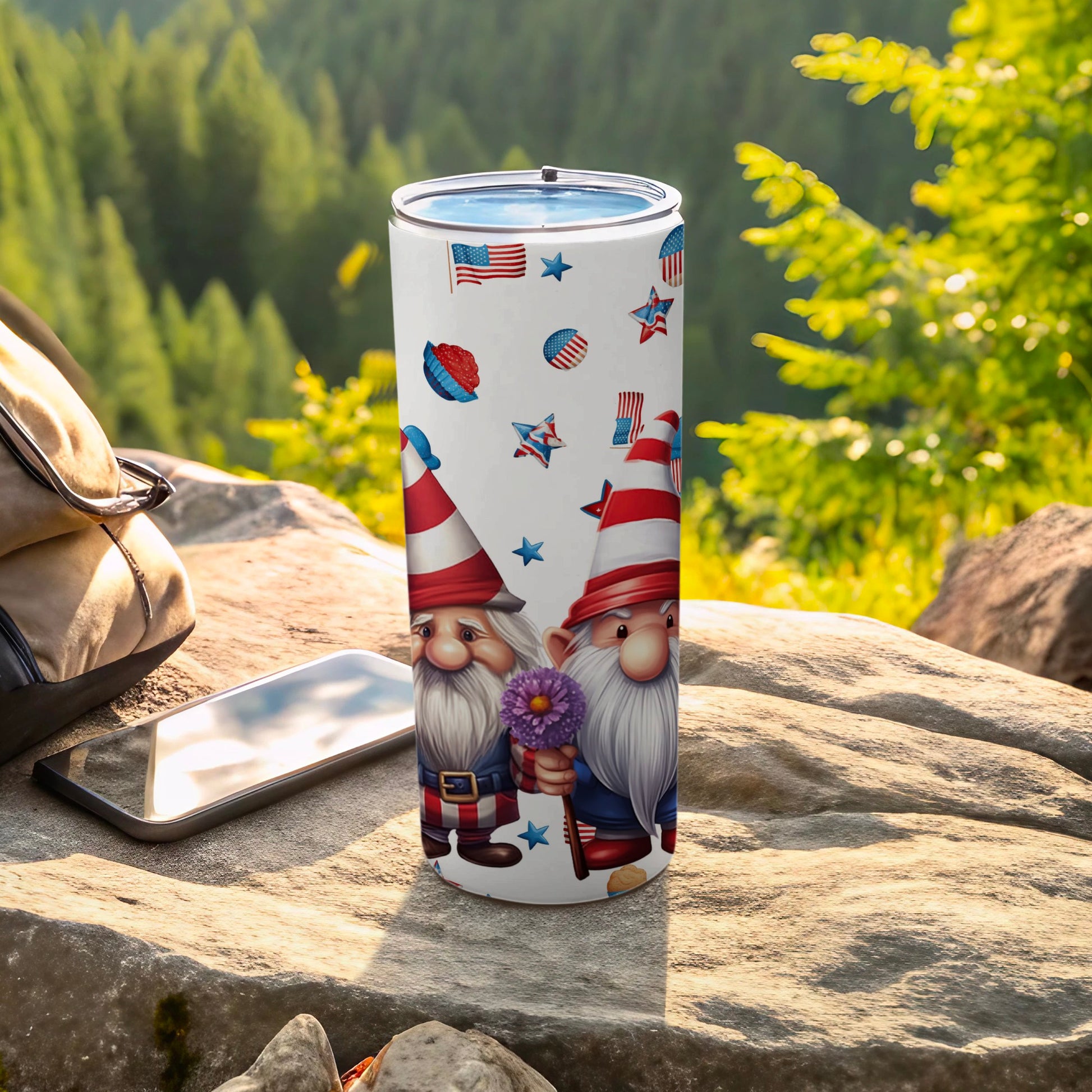 Two gnomes wearing patriotic hats and holding flowers, on a tumbler.