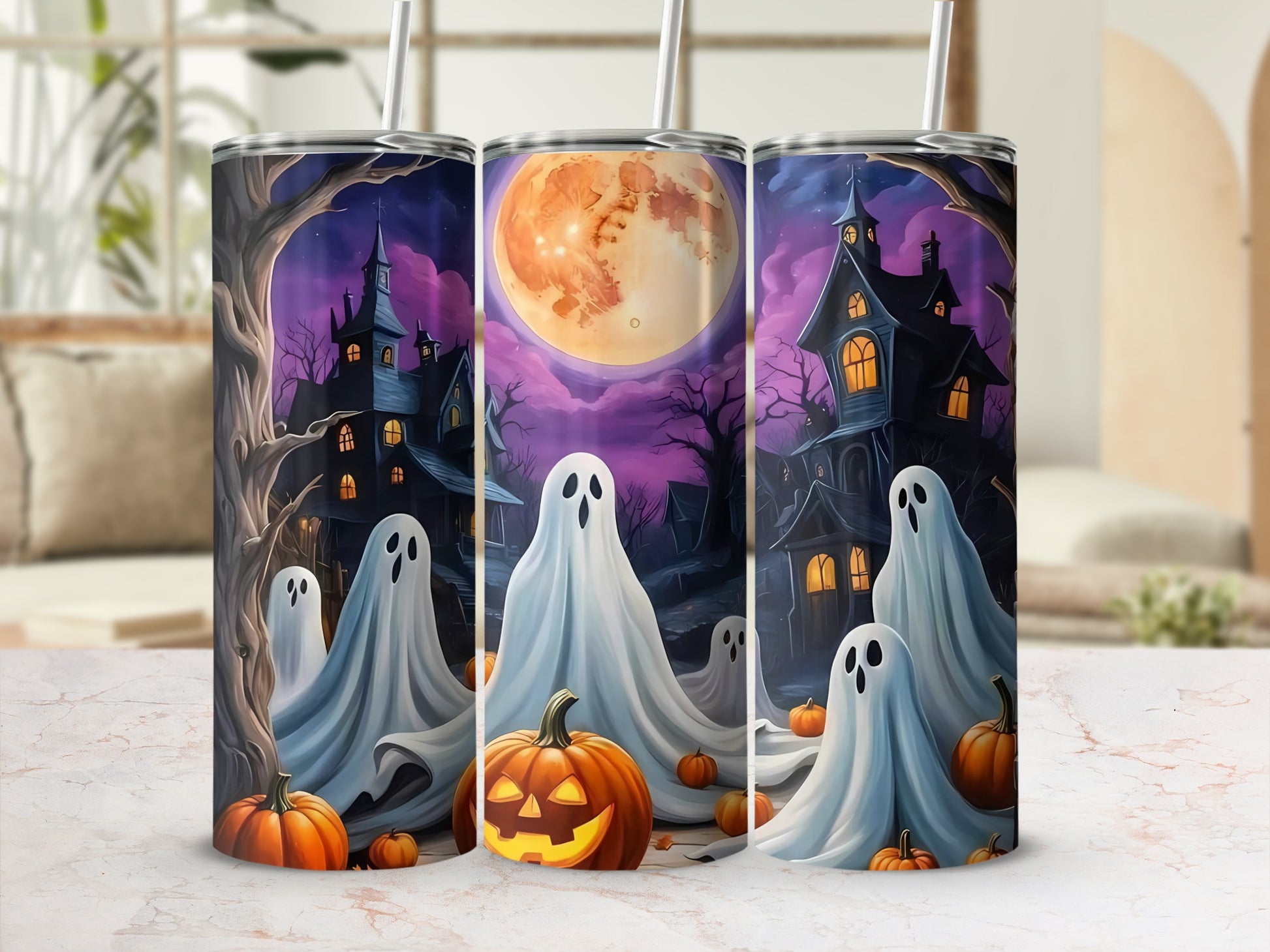 Halloween tumblers with ghosts, pumpkins, spooky houses, and a full moon.