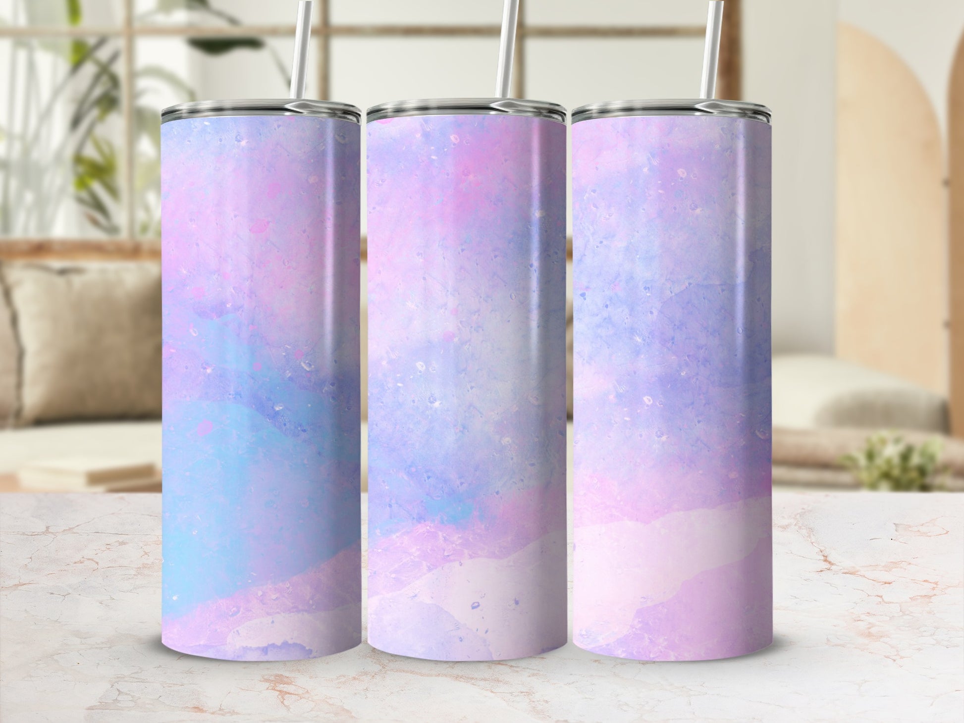 Three tumblers with a pastel watercolor design of pink, blue, and purple.