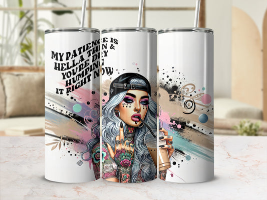 Tattooed woman with colorful hair holds a drink, text reads "My patience is hell thin & you're he humping it right now".