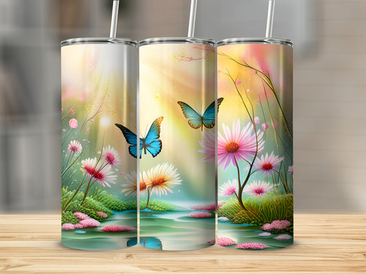 Three tumblers with butterflies and flowers on a wooden surface.