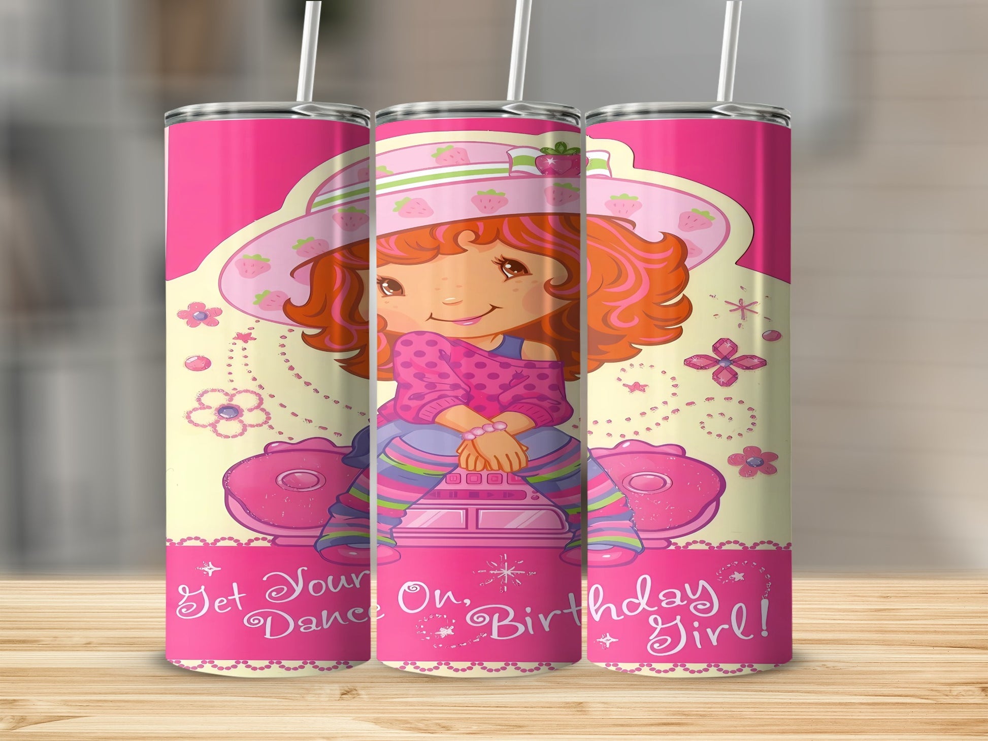Strawberry Shortcake sitting on a pink scooter, "Get Your Dance On, Birthday Girl!"