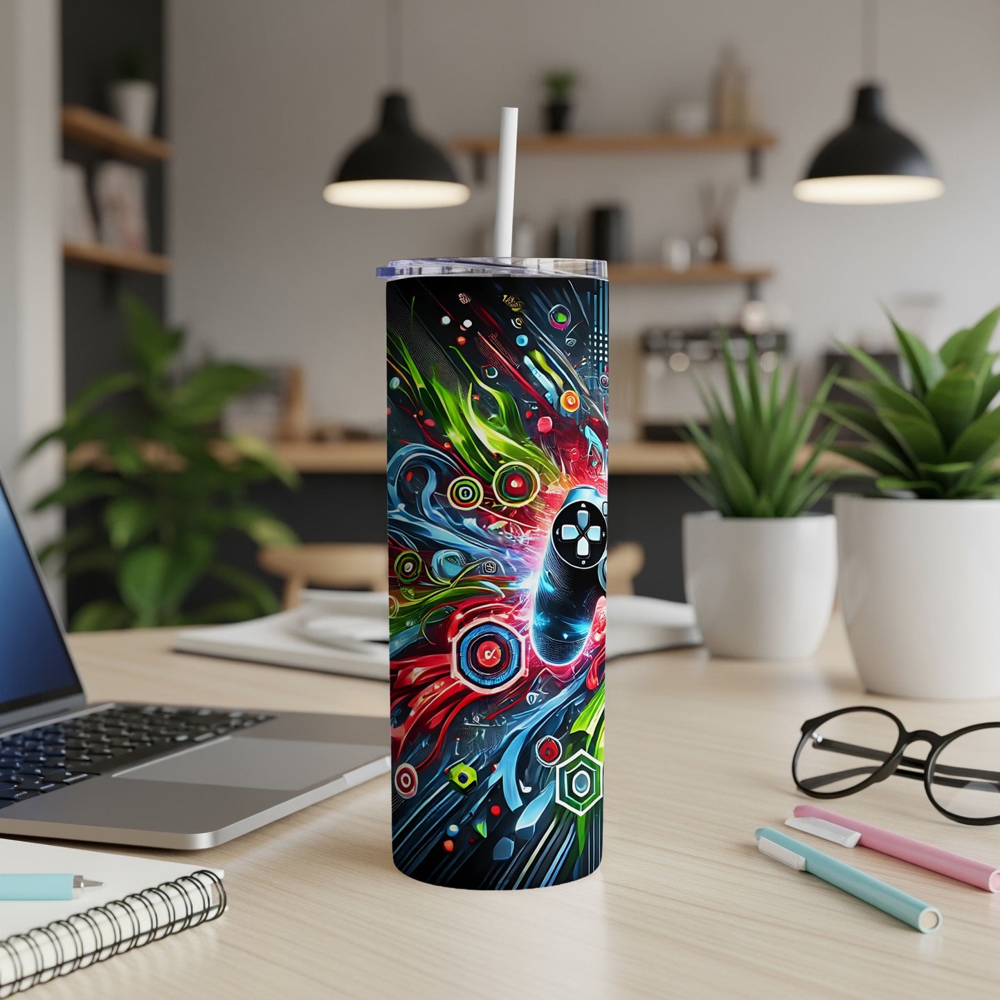 Tall tumbler with colorful abstract gamer design and white straw.