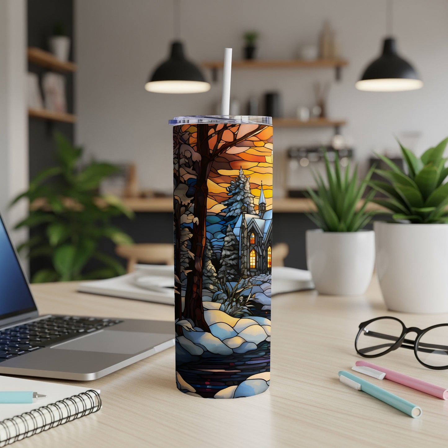 Winter scene with church and trees on a tumbler.