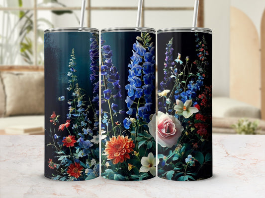 Floral print tumbler with blue and pink flowers and green leaves.