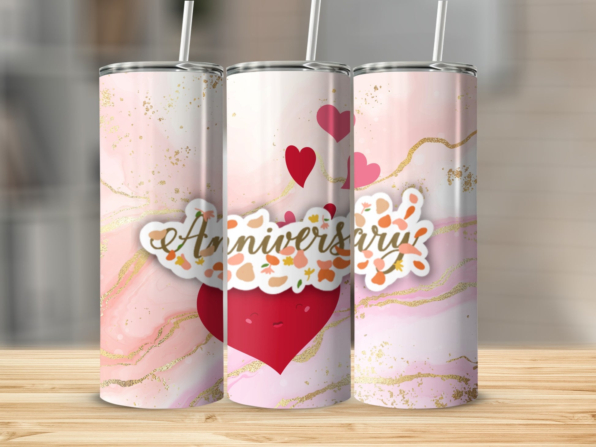 Pink watercolor tumbler with hearts, gold swirls, and "Anniversary" text.