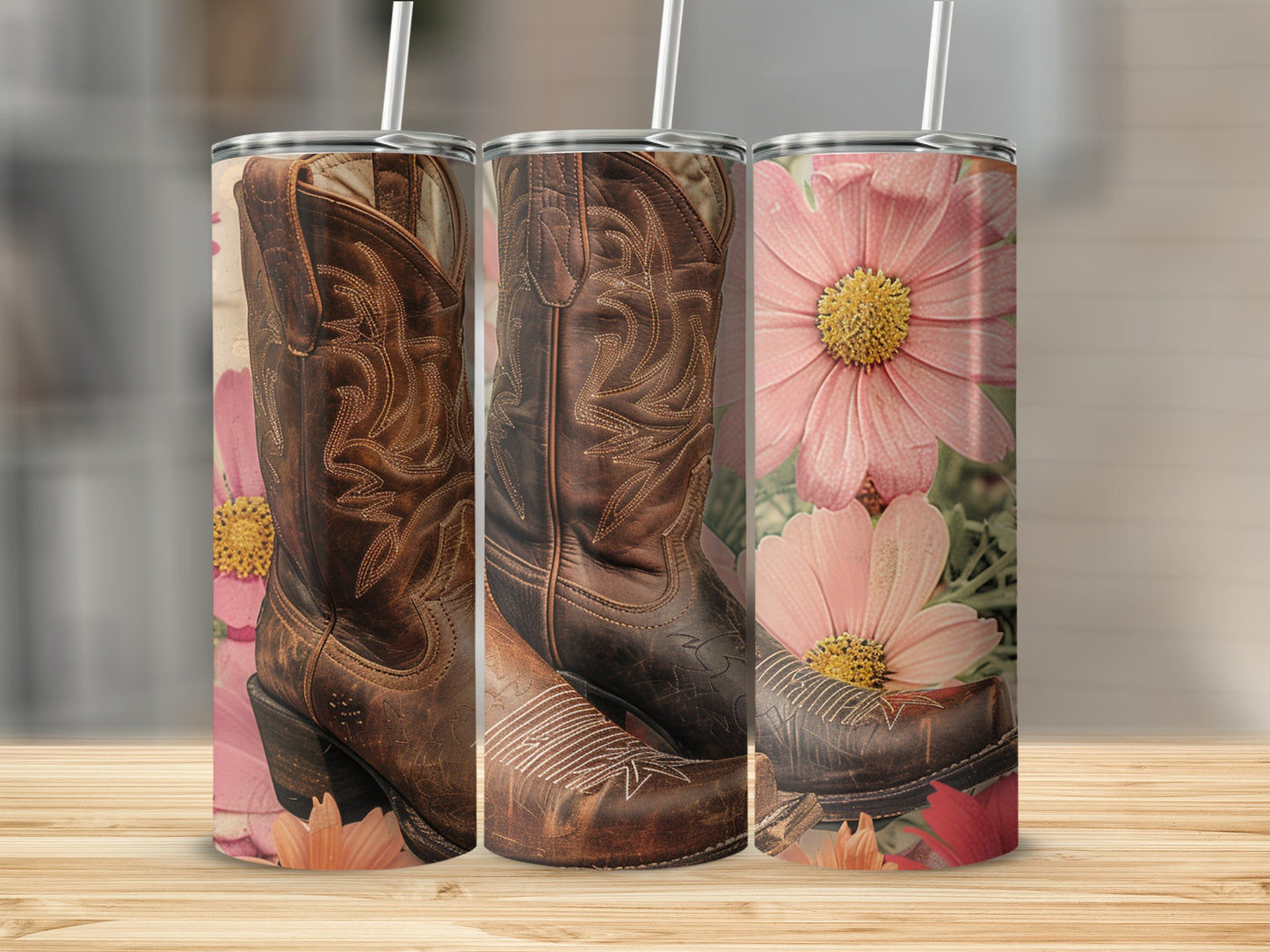 Cowboy boots and floral designs on three tumblers.