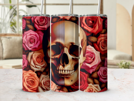 Floral skull tumbler with straw, surrounded by red and pink roses.