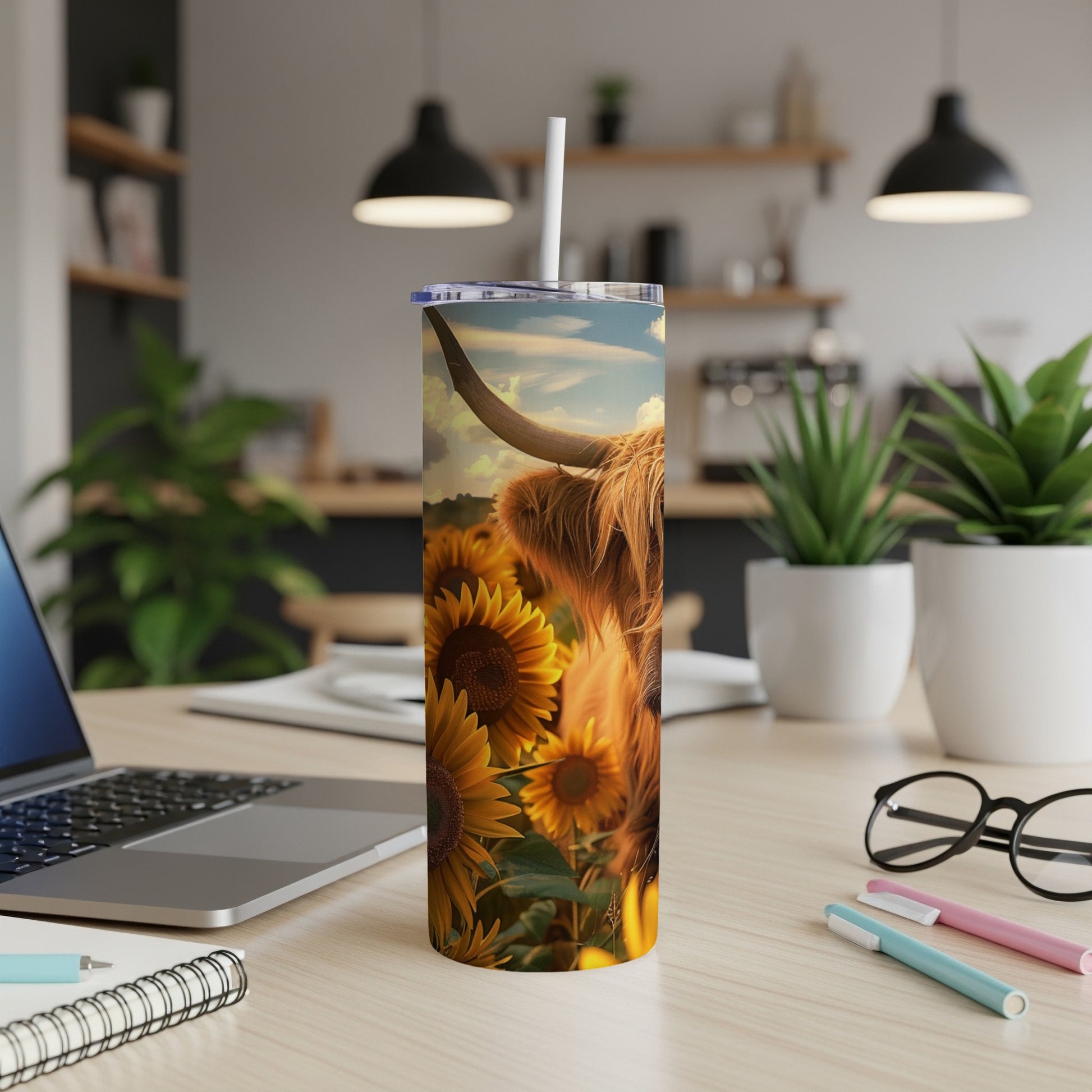 Highland cow and sunflowers on a tumbler with a straw.