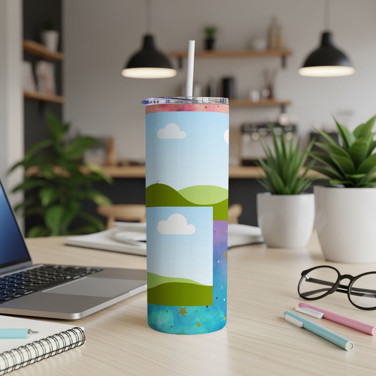 Tumbler with a whimsical landscape, clouds, and starry sky design.