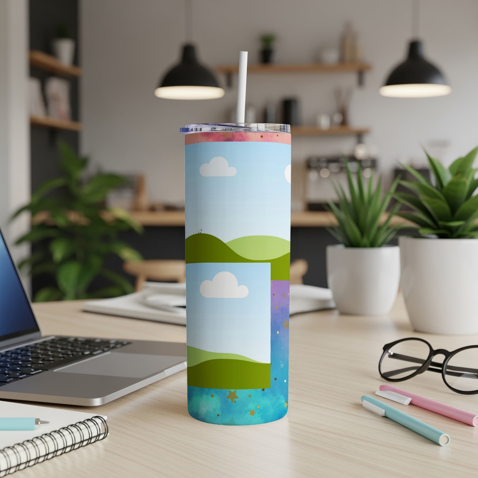 Tumbler with a whimsical landscape, clouds, and starry sky design.