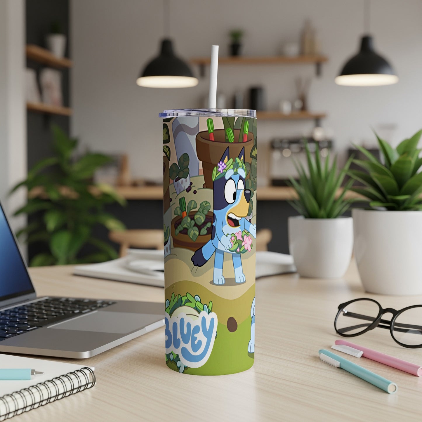 Bluey cartoon character with flowers and plants on a green tumbler.