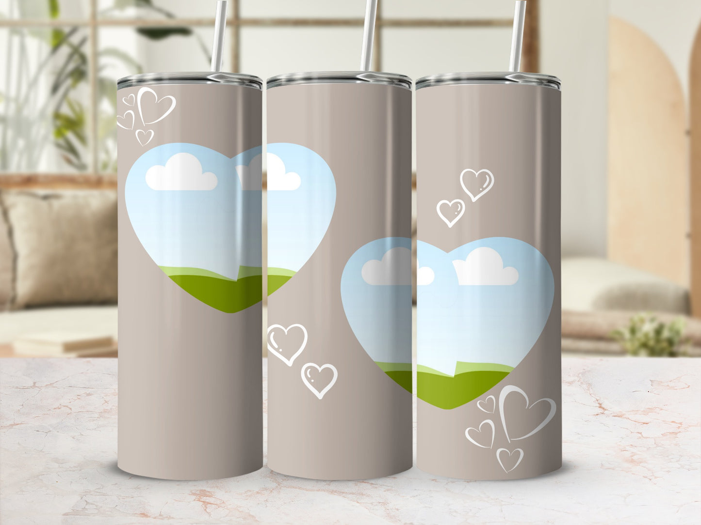 Tan tumblers with heart-shaped landscape inserts and white heart accents.