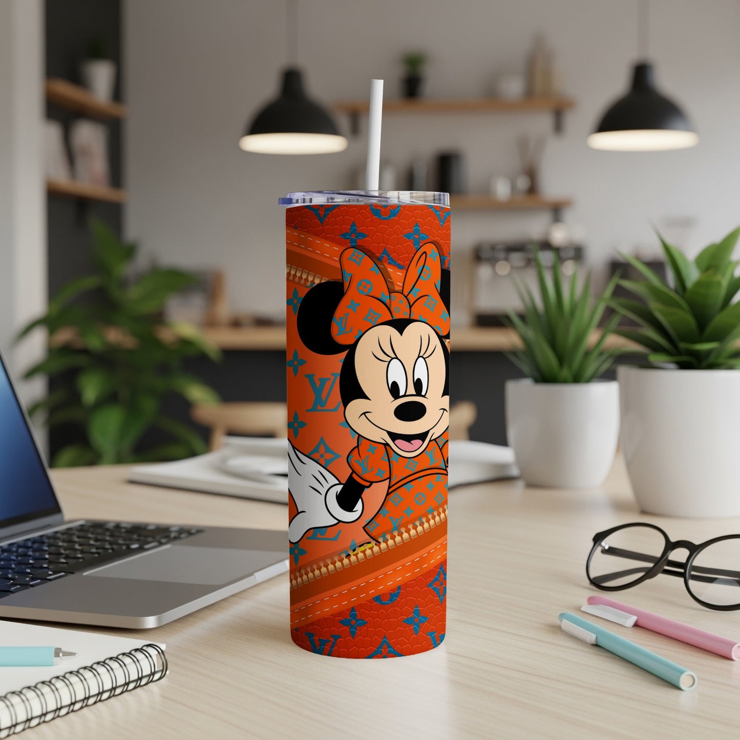 Minnie Mouse on a tumbler with an orange LV-patterned background.