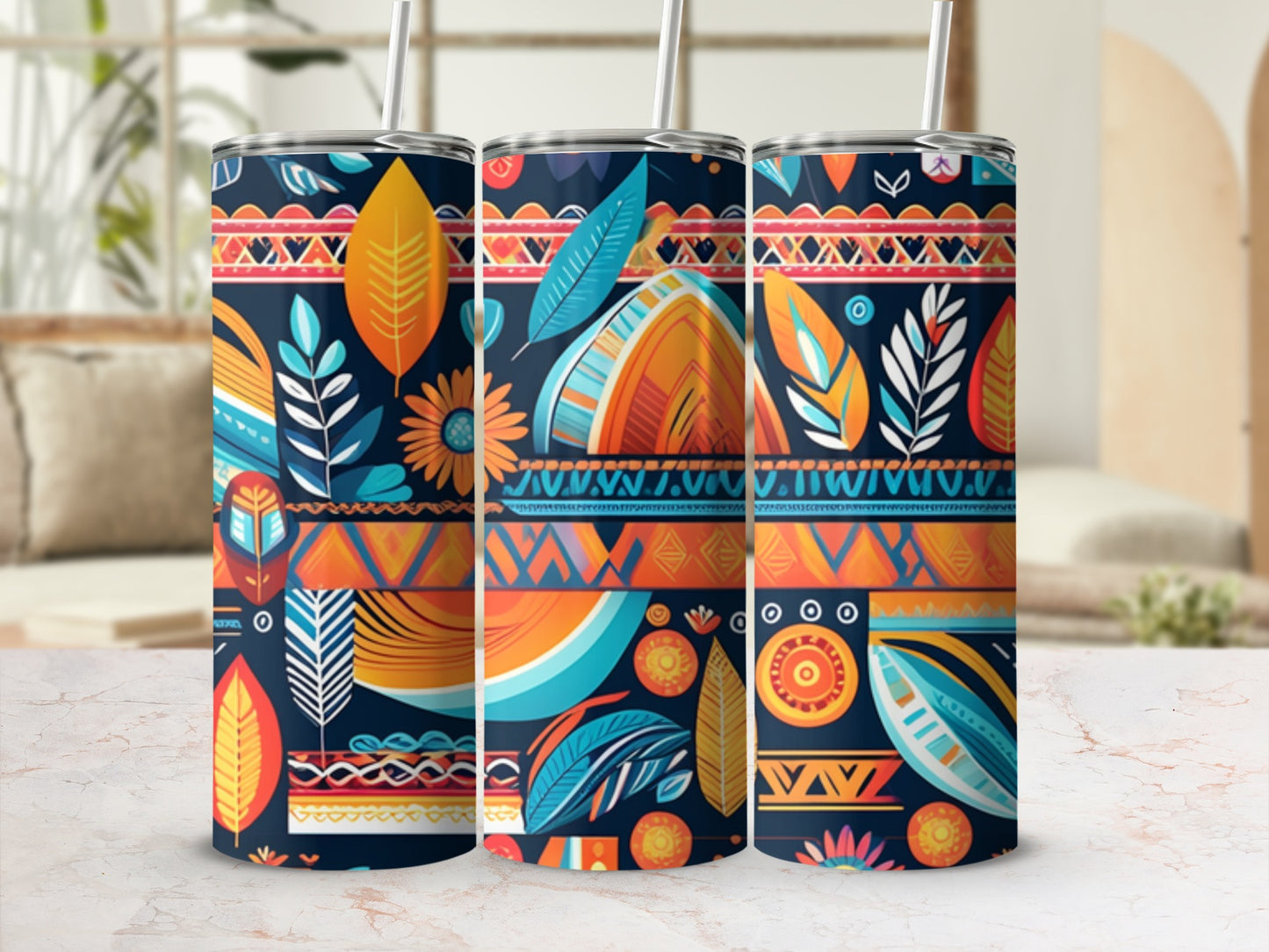 Three patterned tumblers with floral and geometric designs in blue, orange, and yellow.