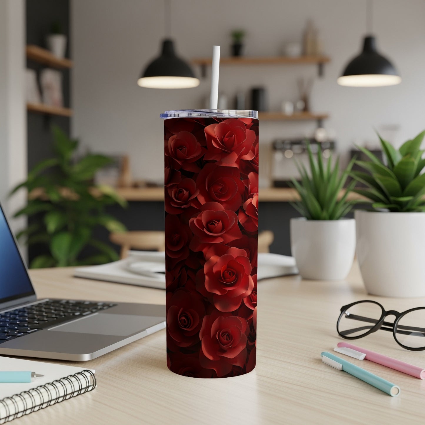 Red rose pattern on a tall, slim tumbler with a straw.