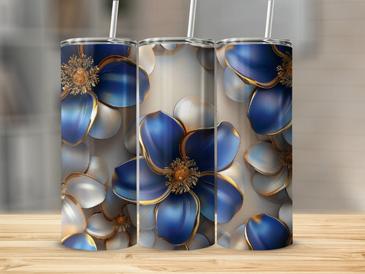 Three floral tumblers with blue and gold petals on a wooden surface.