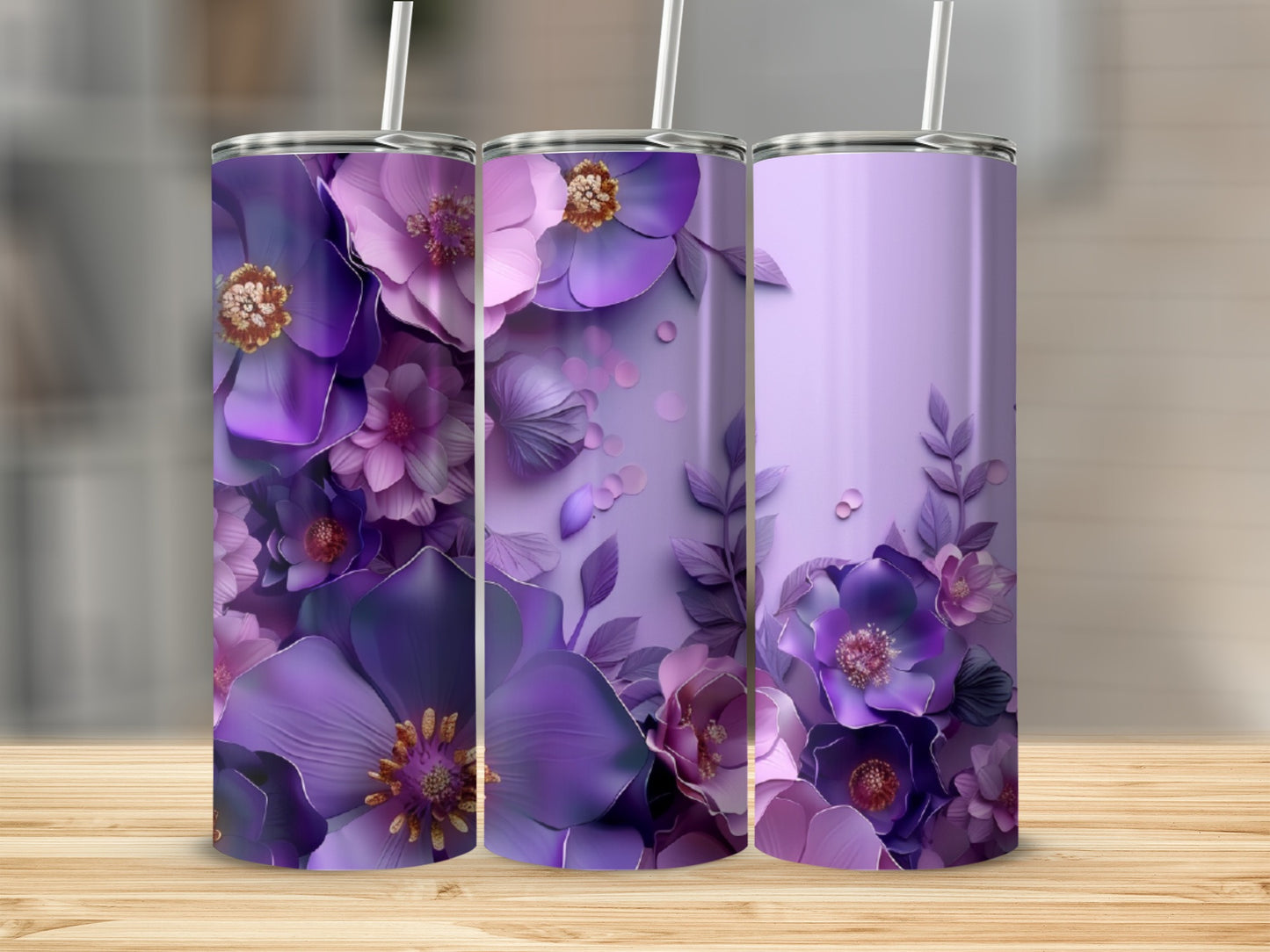 Three purple floral tumblers on a wooden surface.