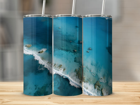 Three tumblers displaying aerial ocean views with white waves and rocky islands.