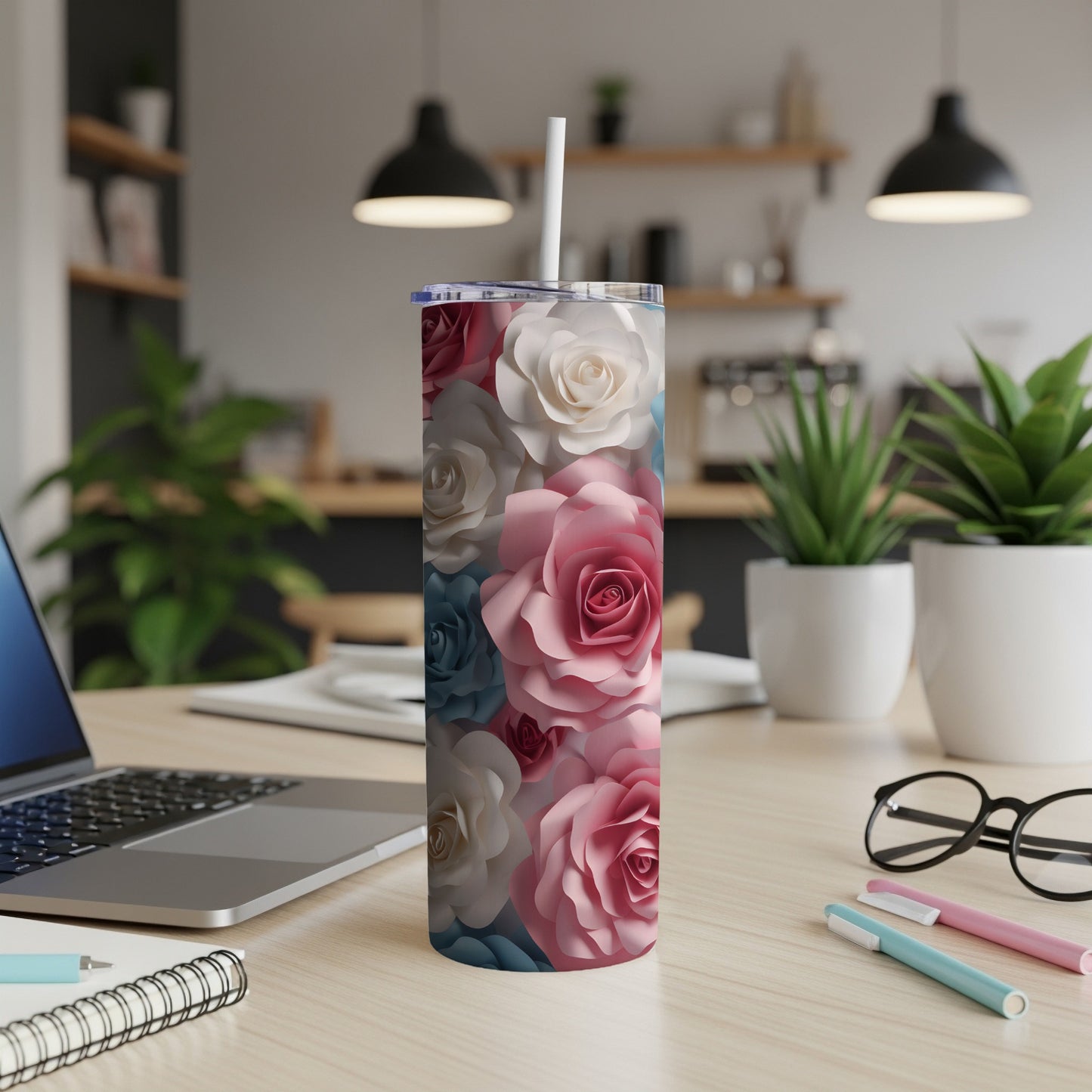 Tall tumbler with pink, white, and blue paper flowers.