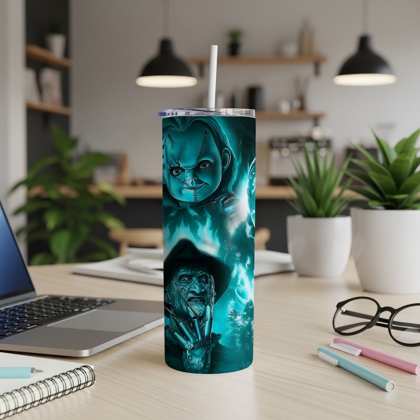 Tumbler with Chucky and Freddy Krueger horror movie characters in teal tones.