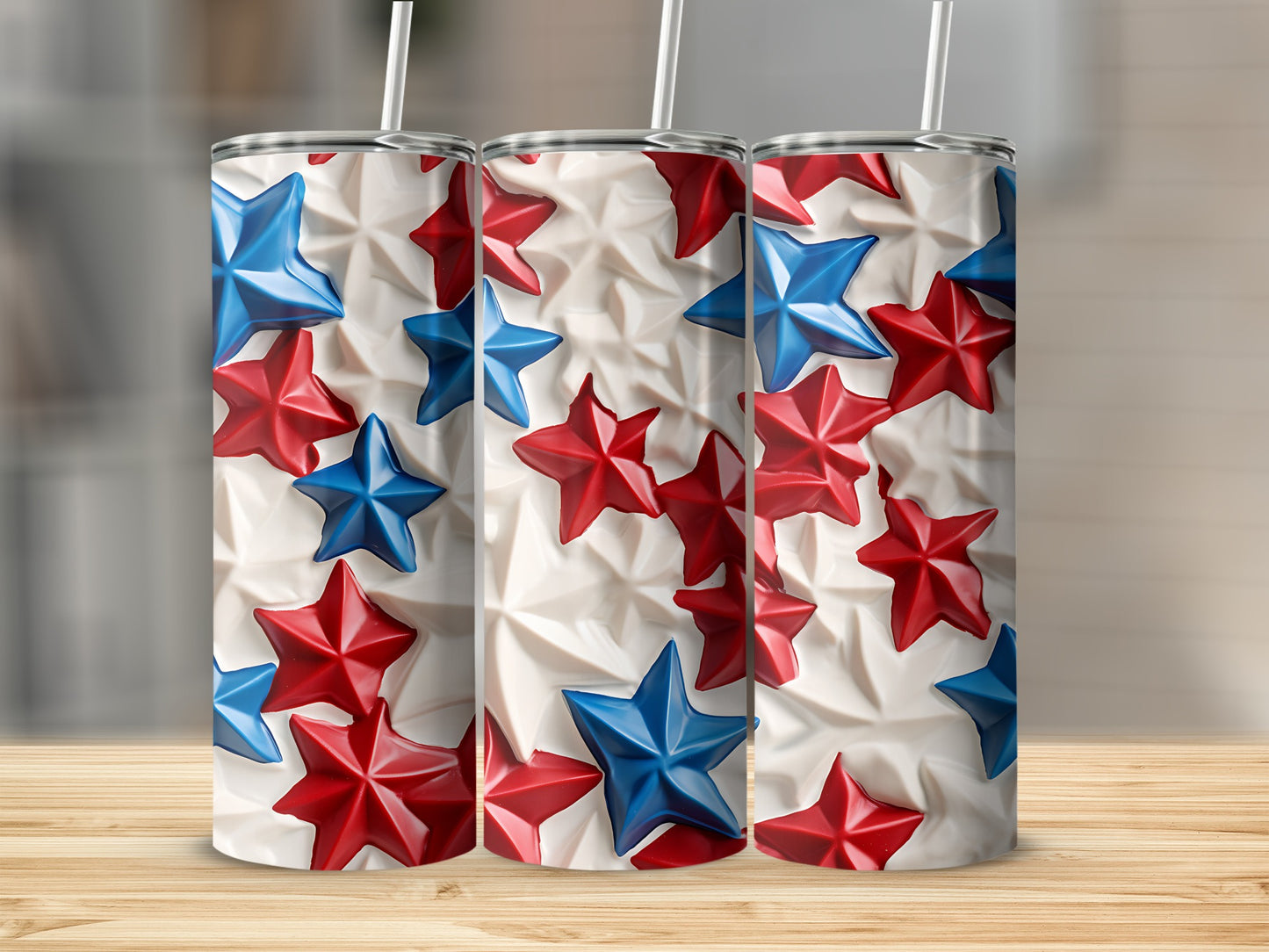 Three tumblers with red and blue stars on a textured white background.