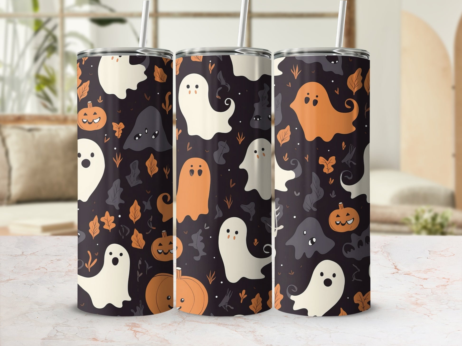 Three tumblers with Halloween ghost and pumpkin pattern on dark background.
