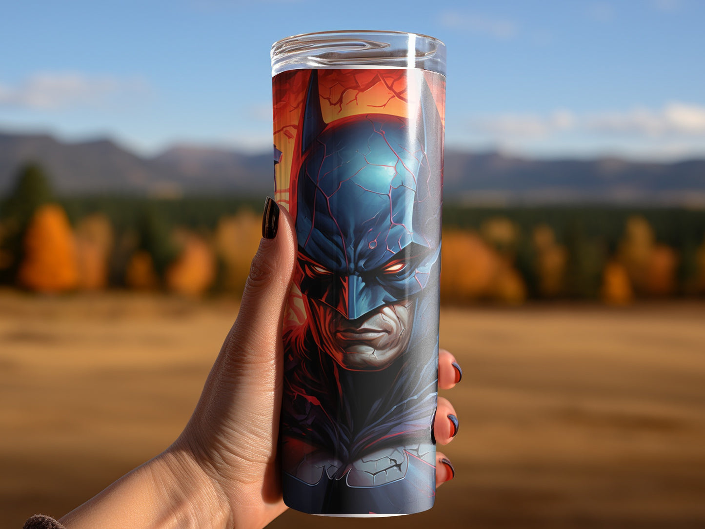 Batman artwork themed travel tumbler with a scenic background