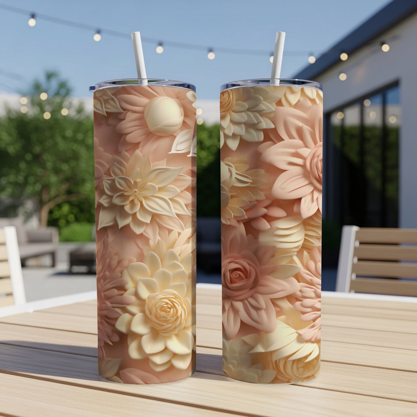 Two tumblers with floral patterns on a wooden table.