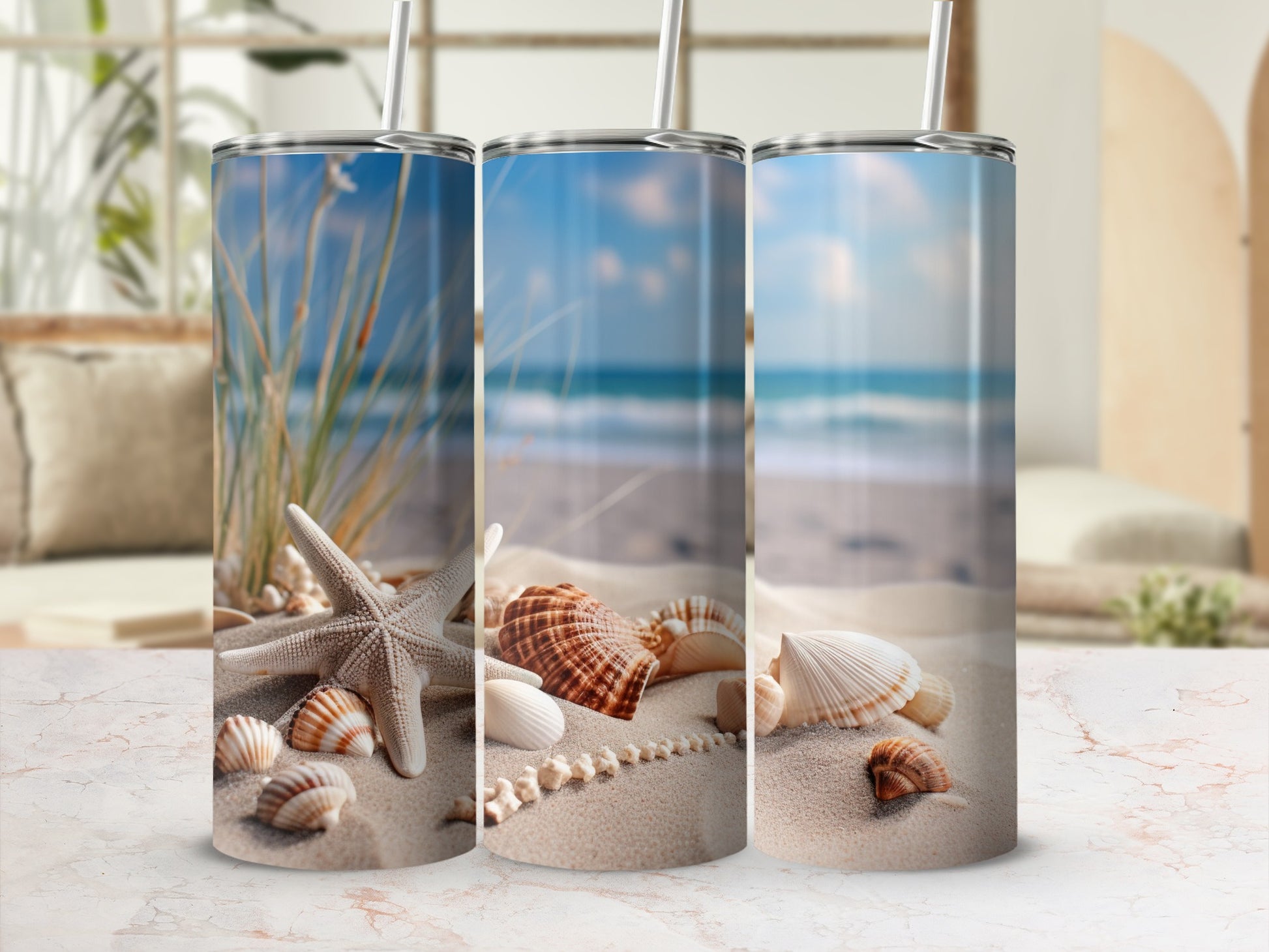 Three tumblers with beach scene: starfish, shells, and ocean waves.