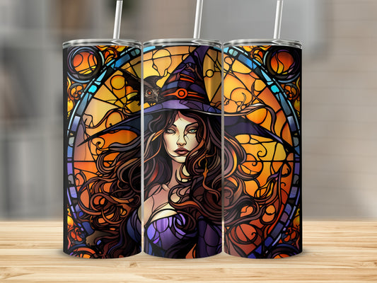 Witch in stained glass design on a tumbler with straw.
