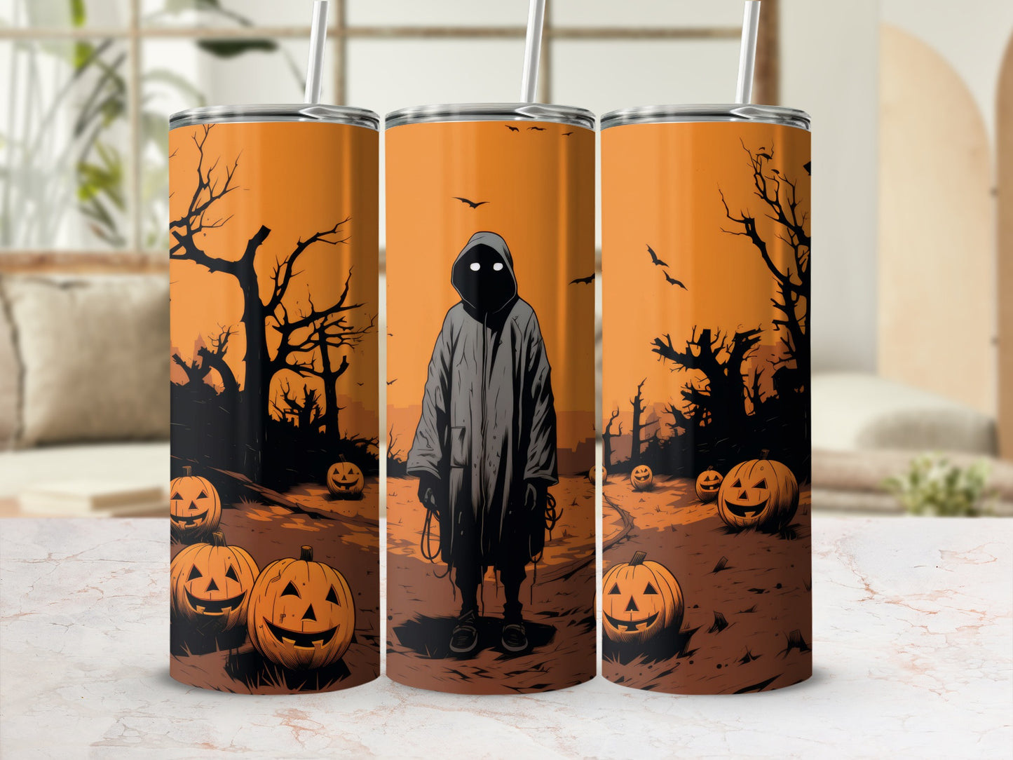 Three tumblers with a spooky Halloween design featuring pumpkins and a cloaked figure.