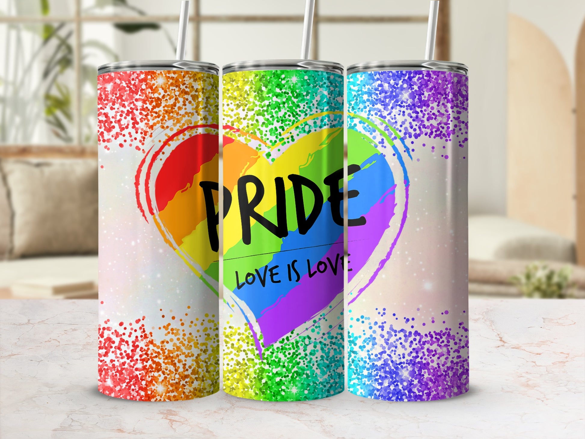 Three rainbow heart tumblers with glitter accents and "Love is Love" text.