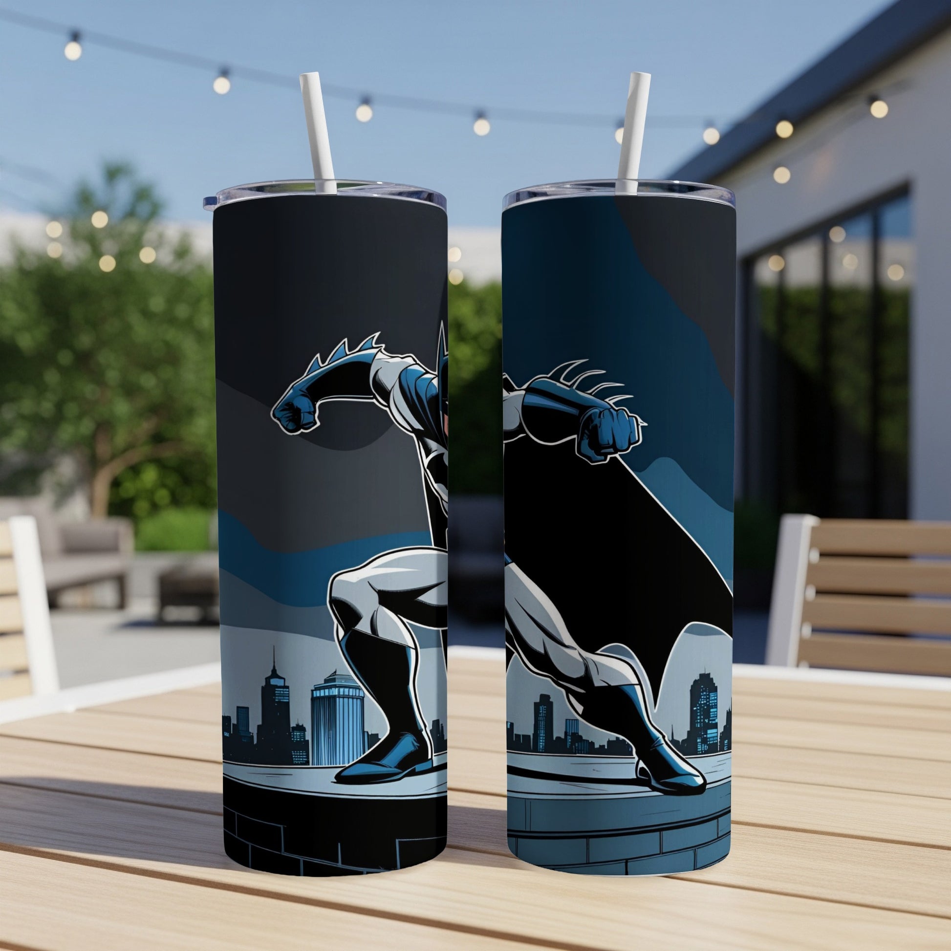 Two tumblers featuring Batman on a cityscape, with a straw in each.