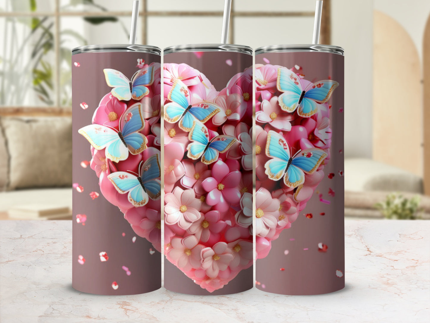 Three tumblers adorned with a pink heart filled with pink and white flowers and blue butterflies.