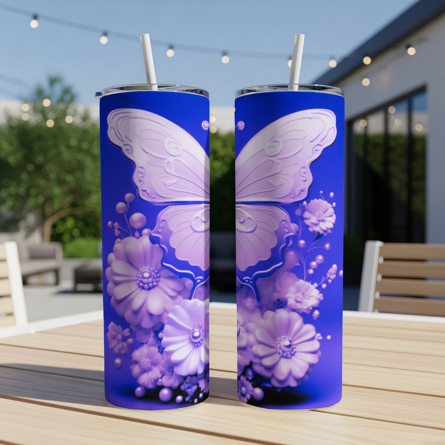 Blue tumbler with intricate purple butterfly and floral design.