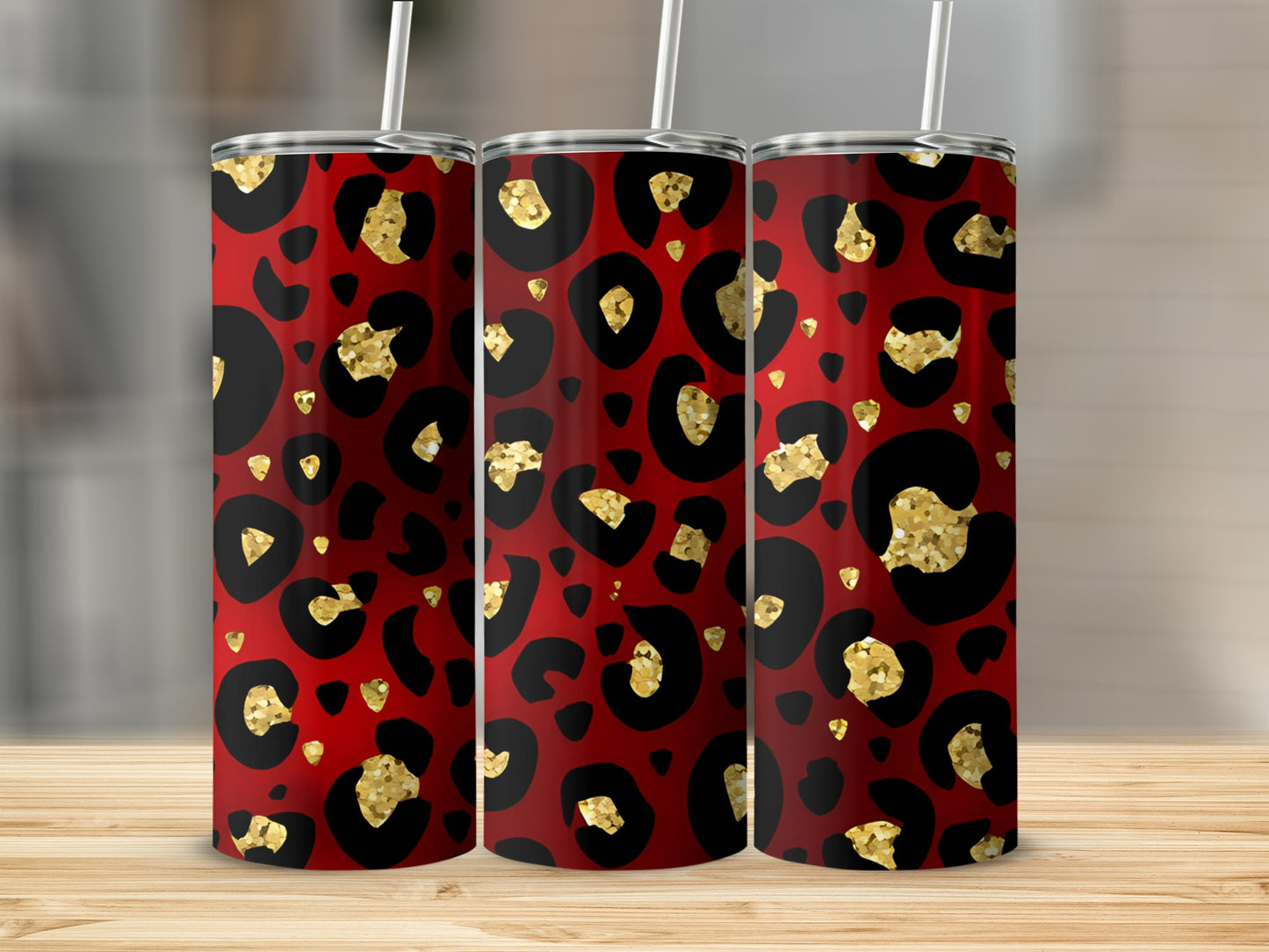 Red tumbler with black and gold leopard print pattern, shown with straw.