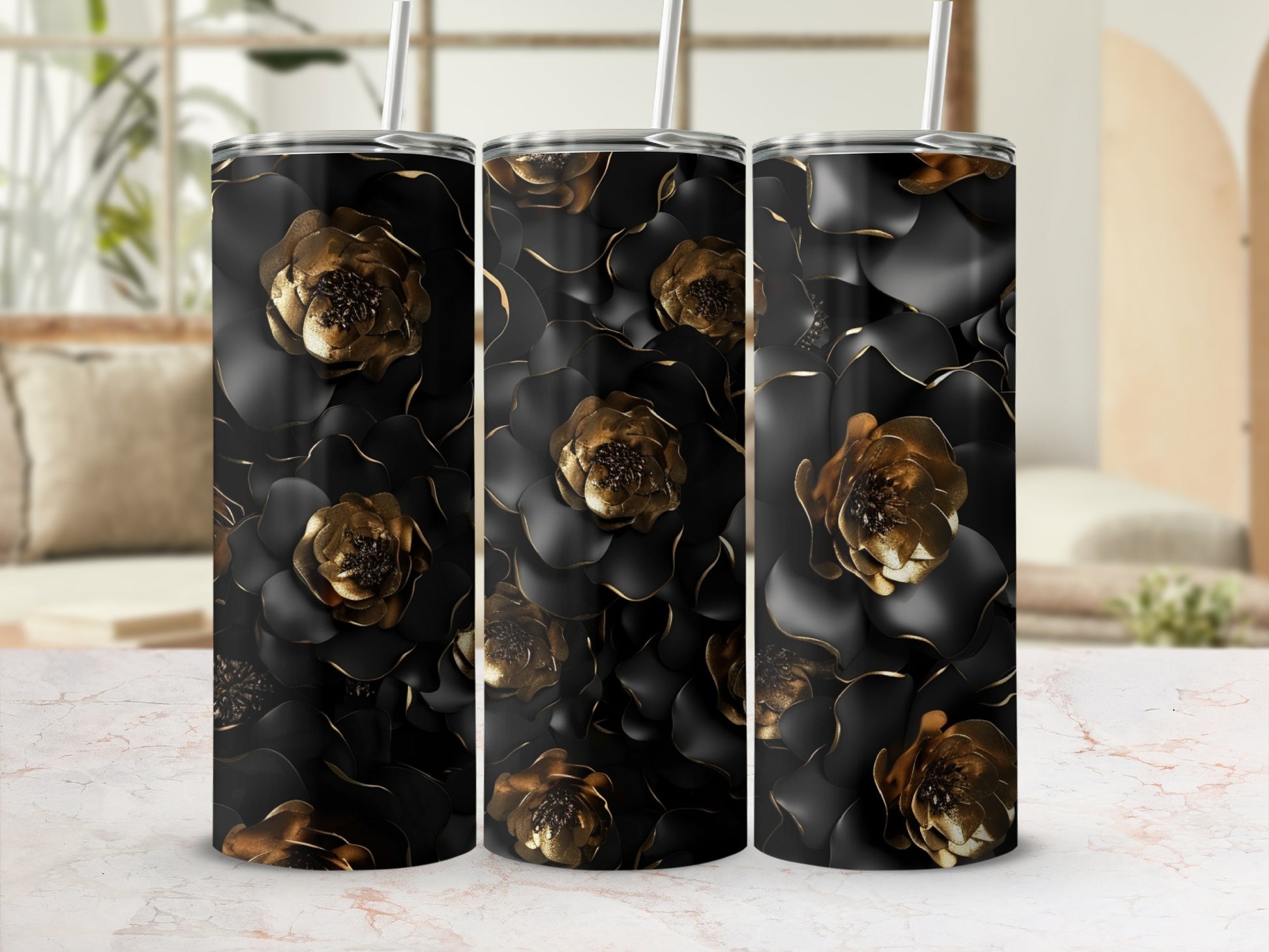 Triptych of black tumblers with embossed gold floral pattern.