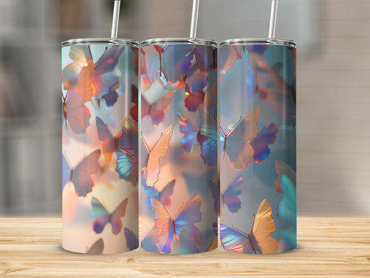 Three tumblers with a colorful butterfly pattern, displayed on a wooden surface.