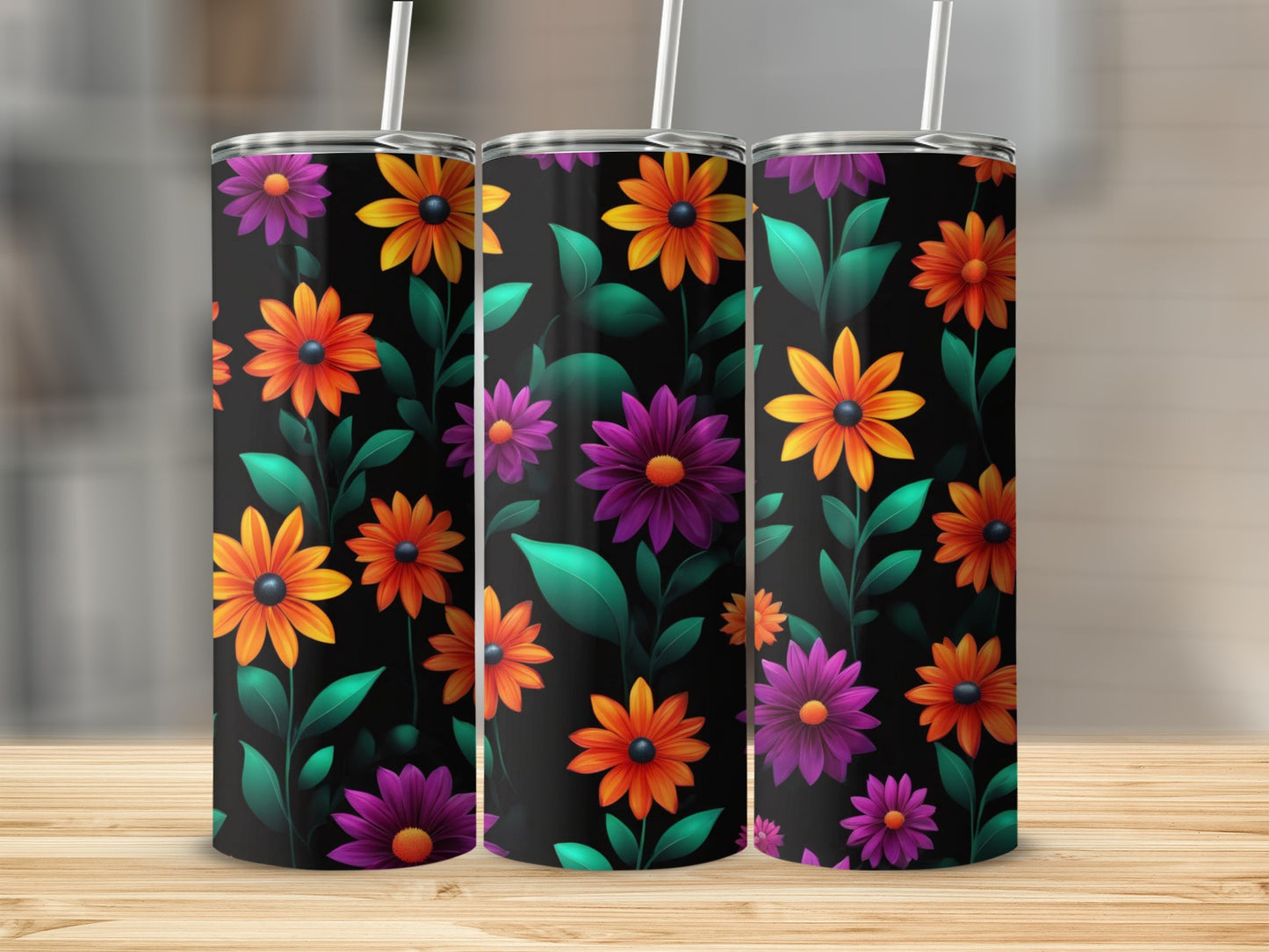Three tumblers with a repeating pattern of orange, yellow, and purple flowers.