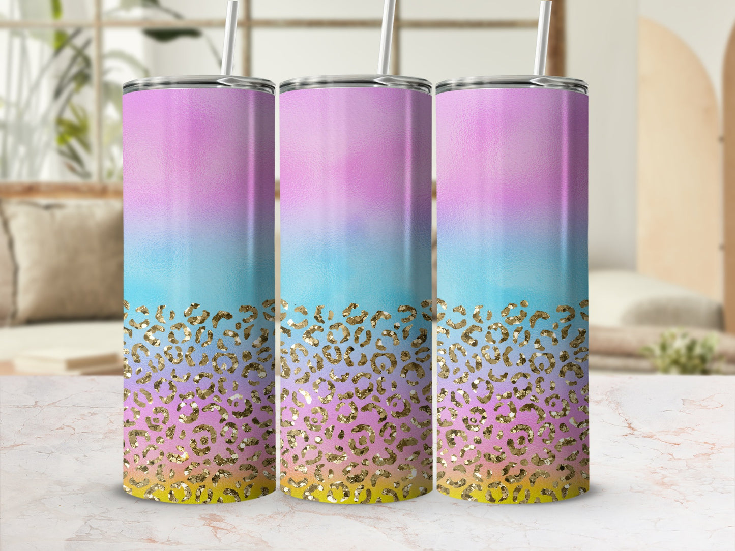 Three tumblers with pastel ombre and gold leopard print designs.