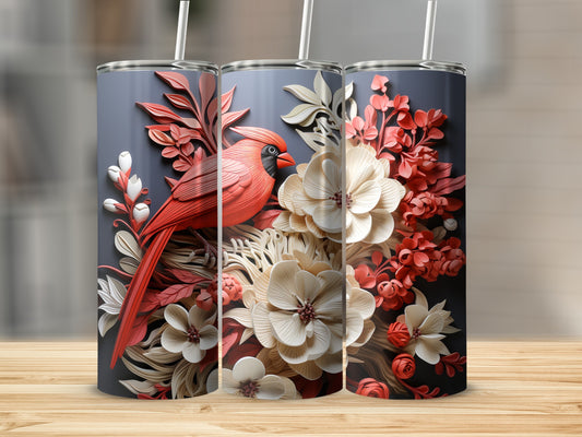 Cardinal perched on floral branches on a cylindrical tumbler.