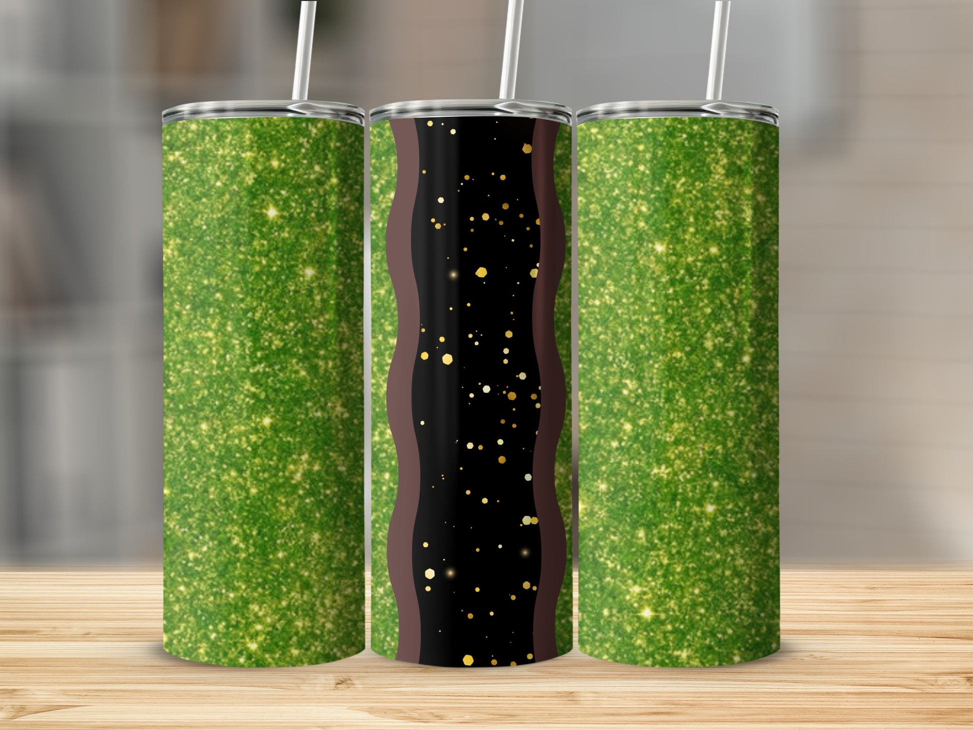Three glitter tumblers with a black and gold wavy design in the center.