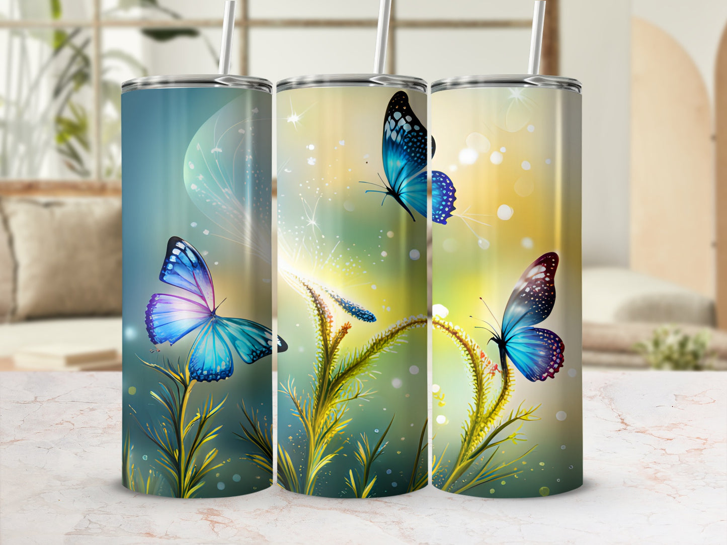 Three tumblers with blue butterflies and glowing flora against a bokeh background.