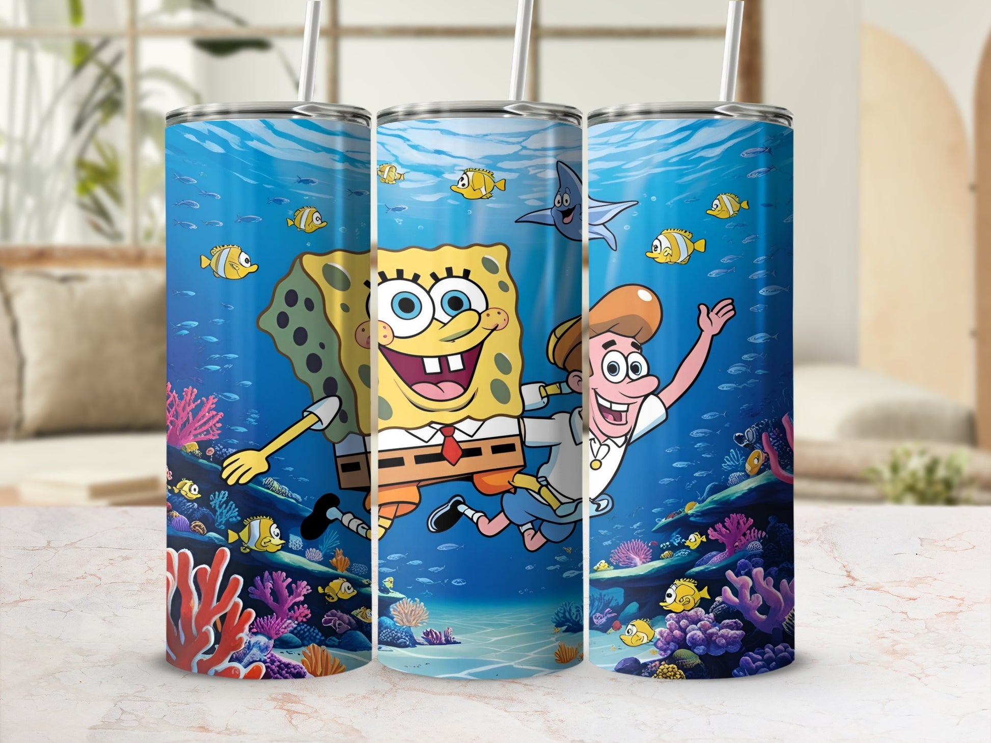 SpongeBob SquarePants and Patrick Star cartoon characters on a blue tumbler with ocean background.