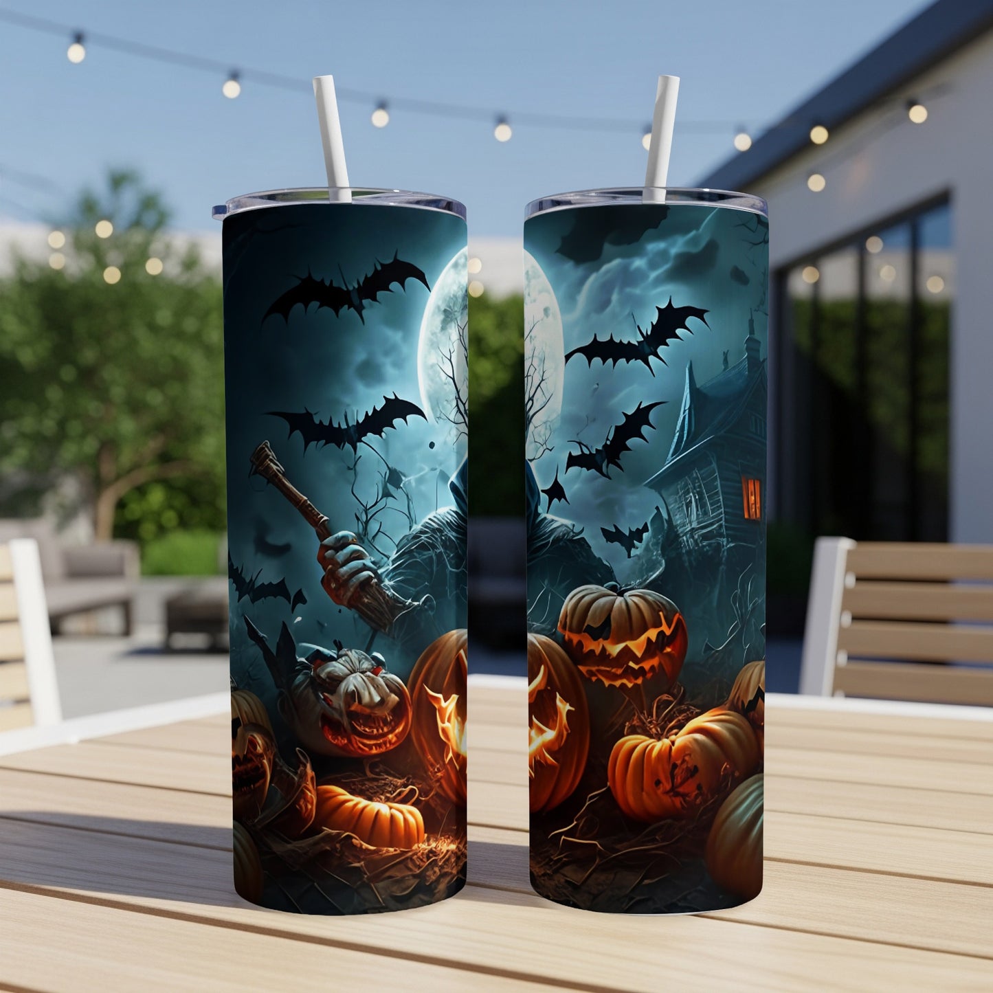 Two tumblers with a Halloween design featuring pumpkins, bats, a grim reaper, and a haunted house.