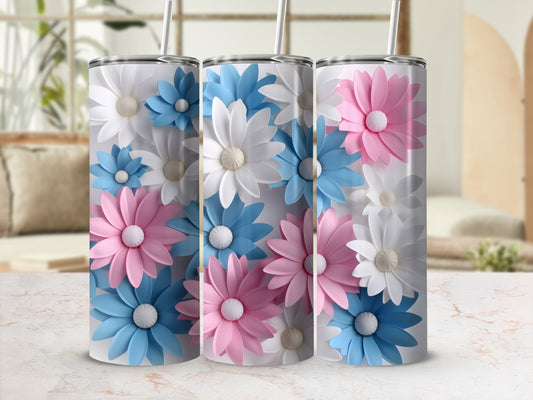 Three tumblers with white, blue, and pink floral designs on a marbled surface.
