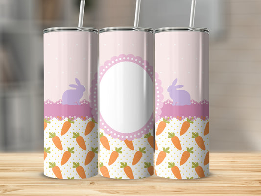 Pink tumbler with rabbits and carrots, blank oval label in center.